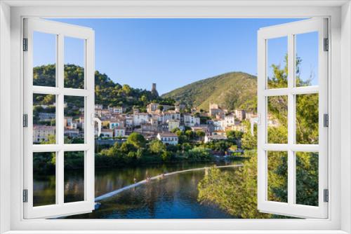 Fototapeta Naklejka Na Ścianę Okno 3D - Vue en fin de journée du village médiéval de Roquebrun au bord de l'Orb dans le Parc naturel régional du Haut-Languedoc