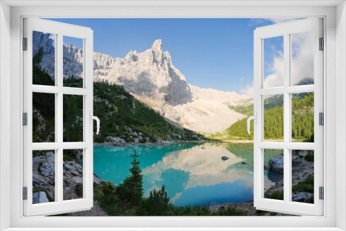 Fototapeta Naklejka Na Ścianę Okno 3D - Stunning view of Lake Sorapis with its turquoise waters and surrounded by beautiful rocky mountains.  Lake Sorapis is one of the most beautiful excursions in the Dolomites, Italy.
