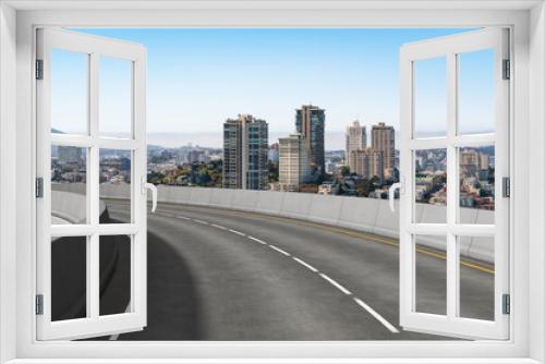 Fototapeta Naklejka Na Ścianę Okno 3D - Empty urban asphalt road exterior with city buildings background. New modern highway concrete construction. Concept way to success. Transportation logistic industry fast delivery. San Francisco. USA.