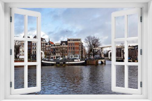 Fototapeta Naklejka Na Ścianę Okno 3D - Typical Amsterdam cityscape. Amsterdam canals, boats and dutch architecture, Netherlands