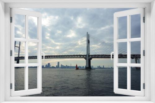 Fototapeta Naklejka Na Ścianę Okno 3D - View of bridge against cloudy sky. Impressive Yokohama bay bridge over Tokyo Bay