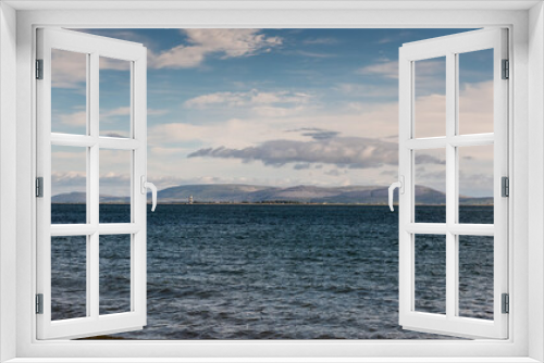 Fototapeta Naklejka Na Ścianę Okno 3D - View on blue ocean water of Galway bay, Ireland. Burren mountains in the background. Soft pastel sky.