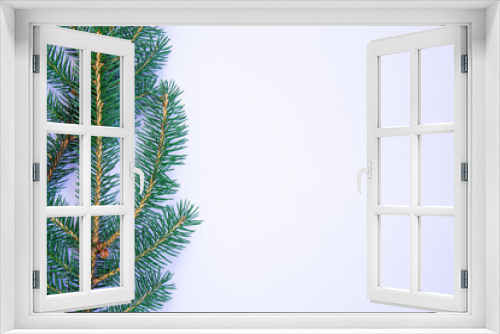 Fototapeta Naklejka Na Ścianę Okno 3D - Christmas background with space for text. Spruce twigs on white background.