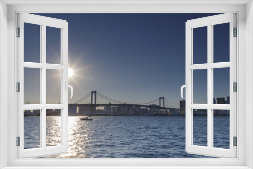 Fototapeta Naklejka Na Ścianę Okno 3D - 豊洲ふ頭から見た日没の東京湾とレインボーブリッジ