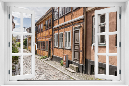 Fototapeta Naklejka Na Ścianę Okno 3D - cobbled lane with traditional picturesque wattle houses, Helsingor, Denmark