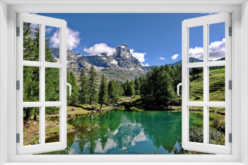 Fototapeta Naklejka Na Ścianę Okno 3D - Summer alpine landscape with the Matterhorn (Cervino) reflected on the Blue Lake (Lago Blu) near Breuil-Cervinia. Aosta Valley, Italy - August 2022