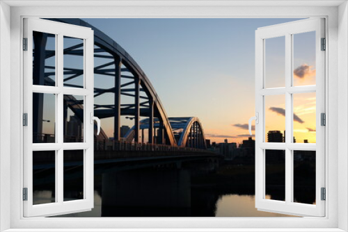 Fototapeta Naklejka Na Ścianę Okno 3D - tama river bridge at sunset