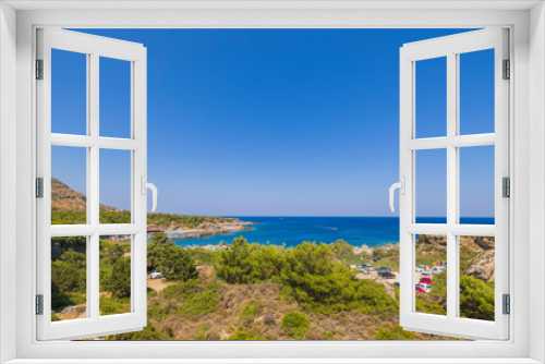 Fototapeta Naklejka Na Ścianę Okno 3D - Beautiful panoramic landscape view of island on dark blue sea water merging with cloudless sky on background. Rhodes. Greece. 