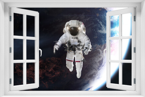 Fototapeta Naklejka Na Ścianę Okno 3D - Astronaut in outer space on background of distant planet. Science fiction. Elements of this image furnished by NASA