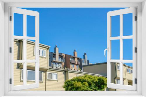 Fototapeta Naklejka Na Ścianę Okno 3D - Townhouses on a sloped area in San Francisco, California