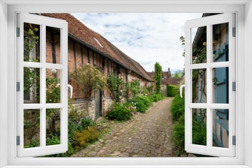 Fototapeta Naklejka Na Ścianę Okno 3D - One of most beautiful french villages, Gerberoy - small historical village with half-timbered houses and colorful roses flowers, France