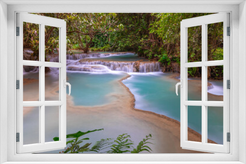 Fototapeta Naklejka Na Ścianę Okno 3D - Magical turquoise blue colours of Kuang Si waterfalls Luang Prabang Laos. these waterfalls in the Mountains of Luang Prabang Laos flow all year round in the natural national park rainforest 