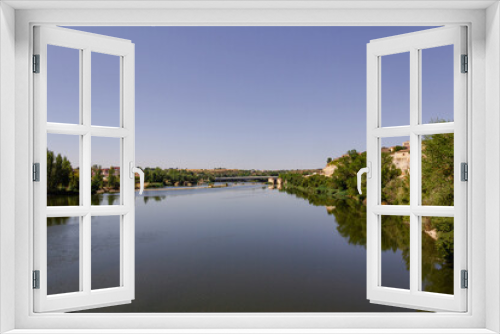 Fototapeta Naklejka Na Ścianę Okno 3D - The Duero River as it passes through the city of Zamora in Spain. Copy space. Selective focus.