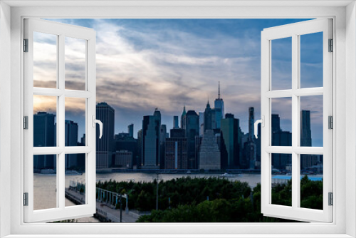Fototapeta Naklejka Na Ścianę Okno 3D - Manhattan skyscrapers view at dramatic sky