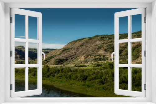Fototapeta Naklejka Na Ścianę Okno 3D - Badflands in summer colours under a blue sky toleman Natural Area Kneehill County Alberta Canada