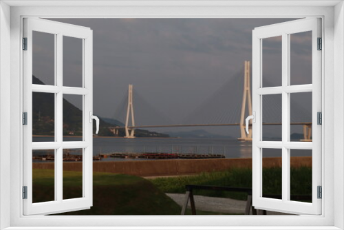 Fototapeta Naklejka Na Ścianę Okno 3D - 大三島から望む夕焼けの多々羅大橋