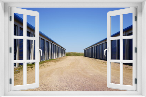Fototapeta Naklejka Na Ścianę Okno 3D - Blue storage unit buildings site.