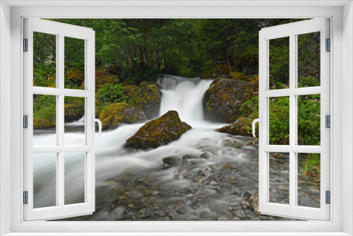 Fototapeta Naklejka Na Ścianę Okno 3D - Tranquile waterfall in green surroundings in Norway