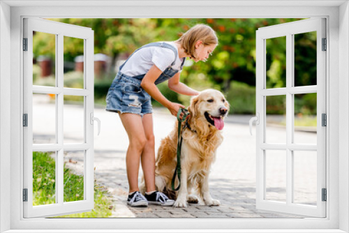 Fototapeta Naklejka Na Ścianę Okno 3D - Girl and golden retriever dog
