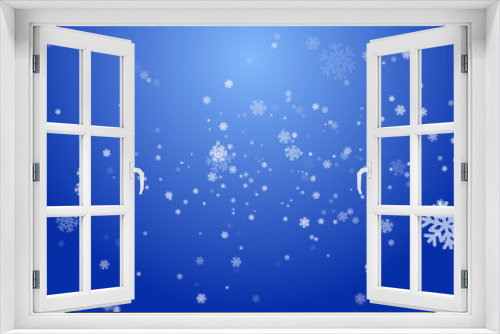 Image of snowflakes falling on blue background