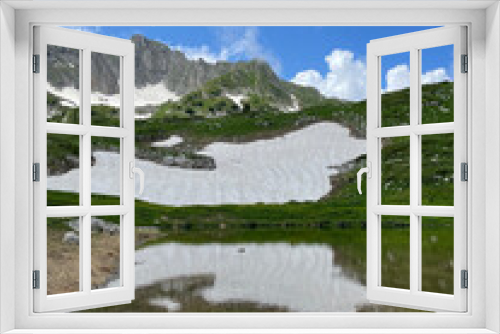 Fototapeta Naklejka Na Ścianę Okno 3D - mountain lake among snowy peaks
