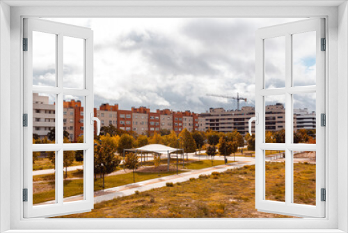 Fototapeta Naklejka Na Ścianę Okno 3D - Autumn cityscape with park and buildings. Selective focus. Copy space.