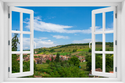 view of an old village in the hills during summer