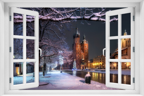 Fototapeta Naklejka Na Ścianę Okno 3D - The main square in Krakow with a view of the cloth hall and St. Mary's Basilica in winter. Rynek główny w krakowie z widokiem na sukiennice, bazylikę mariacką w zimie. 