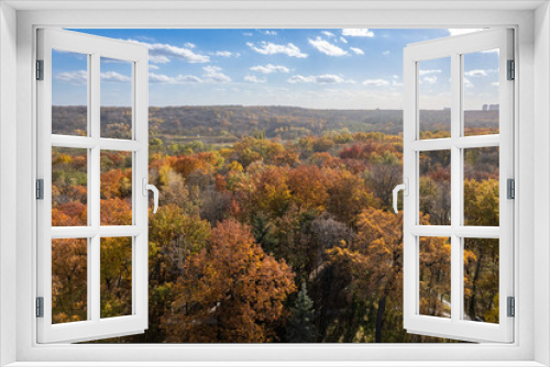 Fototapeta Naklejka Na Ścianę Okno 3D - Aerial view of autumnal park under cloudy sky.