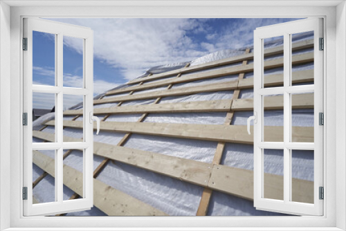 Fototapeta Naklejka Na Ścianę Okno 3D - Roof construction with beams and waterproofing