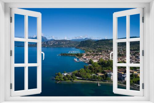 Fototapeta Naklejka Na Ścianę Okno 3D - Aerial view of Bardolino, Lake Garda, Italy. Top view of the historic part of the city of Bardolino on the coastline of Lake Garda. Panorama of the historic town of Bardolino.