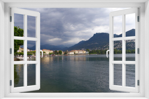 Fototapeta Naklejka Na Ścianę Okno 3D - Scenic view of bay of Lake Lugano, Canton Ticino, on a cloudy summer day. Photo taken July 4th, 2022, Lugano, Switzerland.