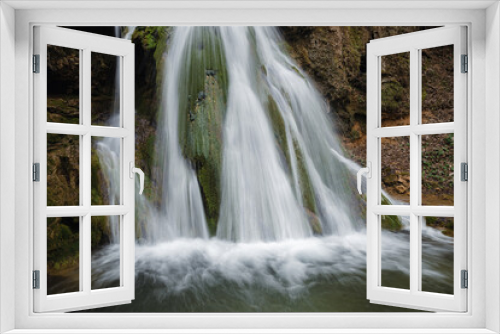 Fototapeta Naklejka Na Ścianę Okno 3D - Beautiful waterfall splashing over mossy rocks