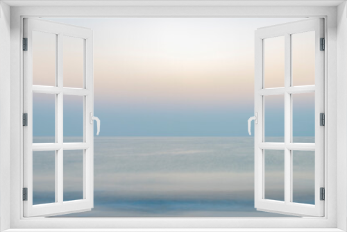 Fototapeta Naklejka Na Ścianę Okno 3D - Abstract background of the Indian Ocean at sunrise, featuring a blurry sea landscape with soothing pastel colors. Perfect for presentations or as a versatile backdrop.