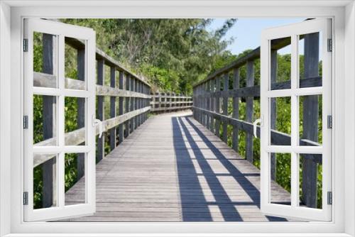 Fototapeta Naklejka Na Ścianę Okno 3D - Wood deck path in Shimajiri mangrove forest that continues straight ahead