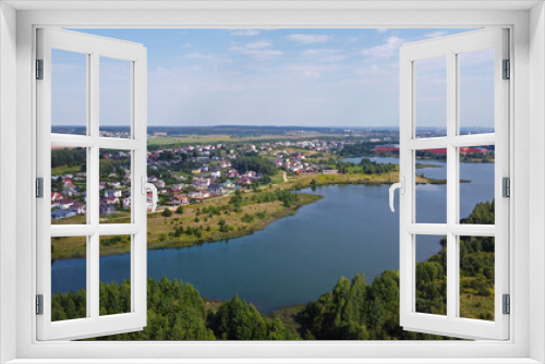 Aerial view of a beautiful suburban lake in an expensive elite neighborhood