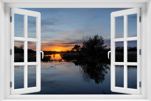 Fototapeta Naklejka Na Ścianę Okno 3D - Sunset view over lakeside with beautiful colours and reflection