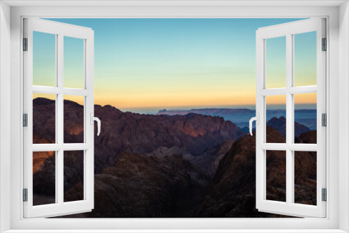 Fototapeta Naklejka Na Ścianę Okno 3D - Amazing Sunrise at Sinai Mountain, Mount Moses with a Bedouin, Beautiful view from the mountain