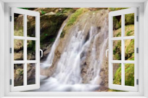 Fototapeta Naklejka Na Ścianę Okno 3D - Waterfall. A stream of water in forest and mountain terrain.
