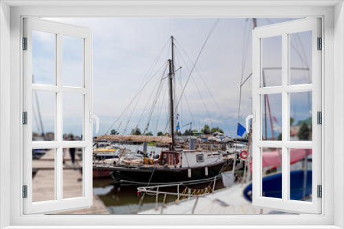 Fototapeta Naklejka Na Ścianę Okno 3D - Wooden yacht in the harbor parking lot. Romantic boat trip.