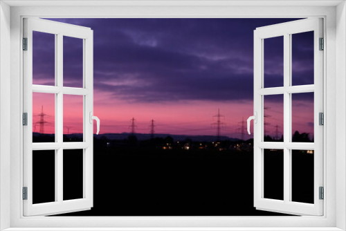 Fototapeta Naklejka Na Ścianę Okno 3D - FU 2022-01-24 Abend 11 Sonnenuntergang in einer Landschaft mit Hochspannungsmasten