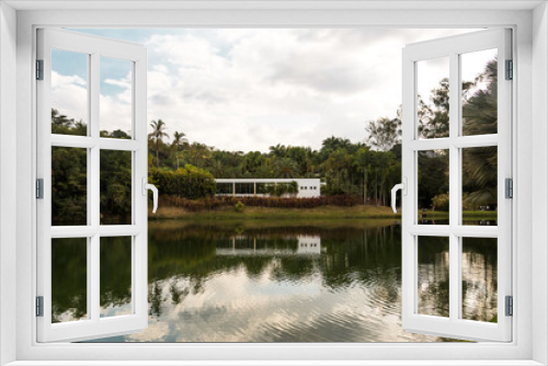 Fototapeta Naklejka Na Ścianę Okno 3D - Lake and a construction for the visitors of the Inhotim Park at Brumadinho, State of Minas Gerais, Brazil.