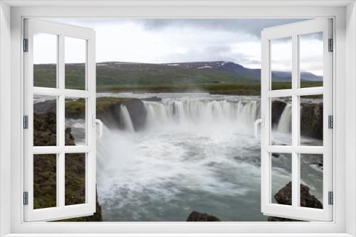 Fototapeta Naklejka Na Ścianę Okno 3D - Goðafoss waterfall in northern Iceland, located along the country's main ring road. The water of the river Skjálfandafljót falls from a height of 12 metres over a width of 30 metres.