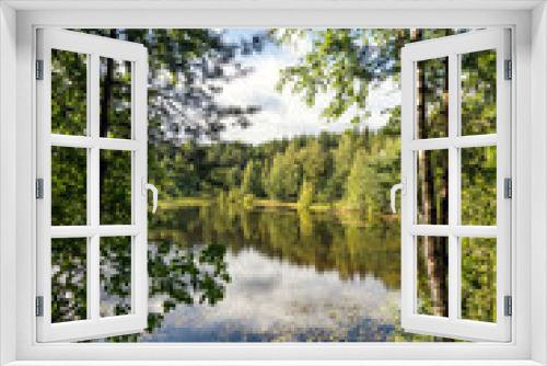 Fototapeta Naklejka Na Ścianę Okno 3D - Beautiful summer landscape with a view of the forest lake and Russian birches.