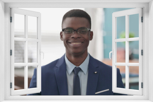 Young African Businessman Smiling at Camera