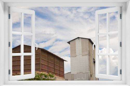 Fototapeta Naklejka Na Ścianę Okno 3D - SILO, BARN OF A CORN AND RICE PROCESSOR BUILT FROM ZINC SHEETS
