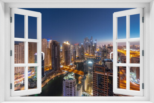 Fototapeta Naklejka Na Ścianę Okno 3D - Panorama of various skyscrapers in tallest recidential block in Dubai Marina aerial night to day timelapse