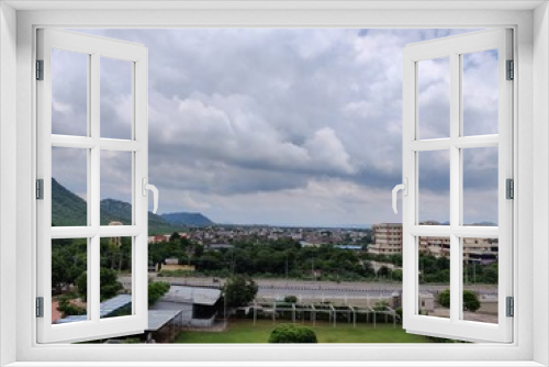 Fototapeta Naklejka Na Ścianę Okno 3D - Image of a building with clouds in sky and hills in background. Chandra Mahal Garden. Aravalli Hills