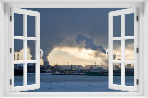 Fototapeta Naklejka Na Ścianę Okno 3D - Industrial landscape on a frozen river. Winter landscape at the docks. Winter navigation in St. Petersburg.