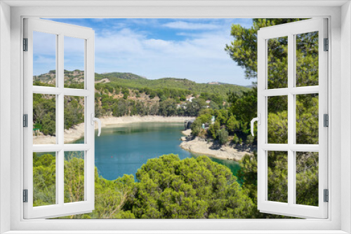 Fototapeta Naklejka Na Ścianę Okno 3D - Spectacular panoramic views of the Guadalhorce reservoir, next to the Caminito del Rey in Malaga, Spain. Turquoise blue water and forest with blue sky on a sunny day.
